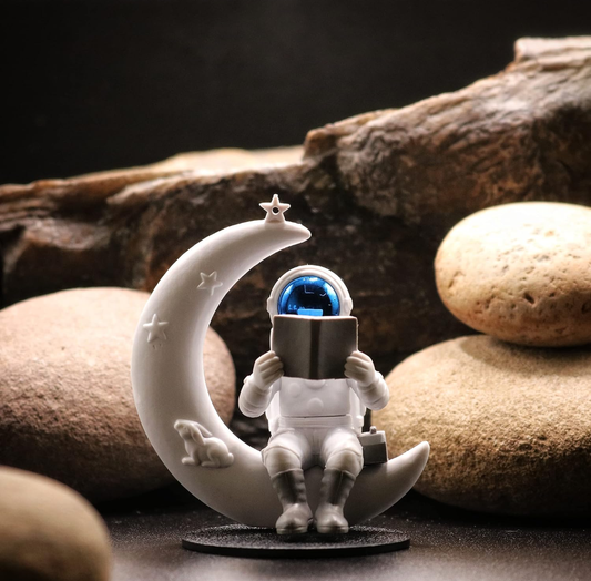 Astronaut Reading on Moon Showpiece