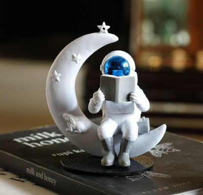 Astronaut Reading on Moon Showpiece