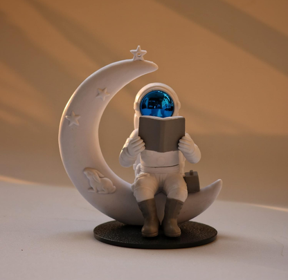 Astronaut Reading on Moon Showpiece
